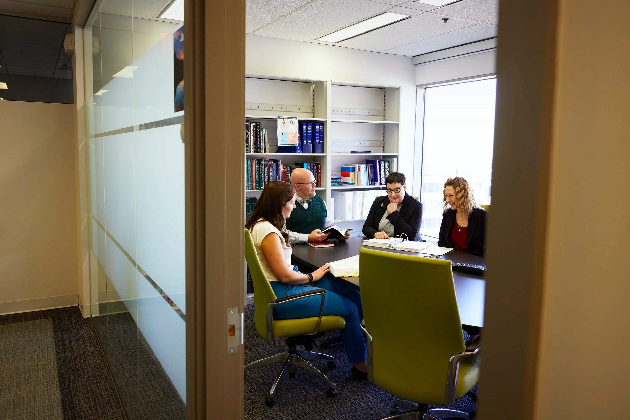 Three colleagues in a meeting room