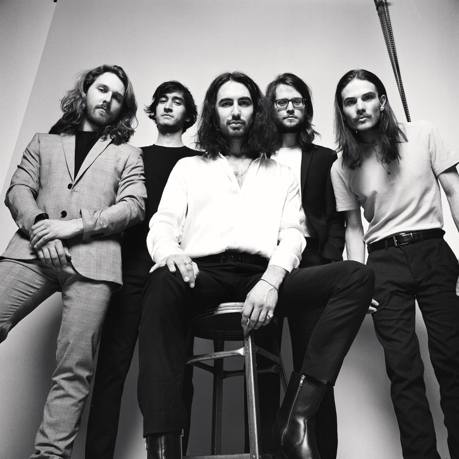 Carter and the Capitals — band portrait in black and white on film, one seated on a stool, Edmonton