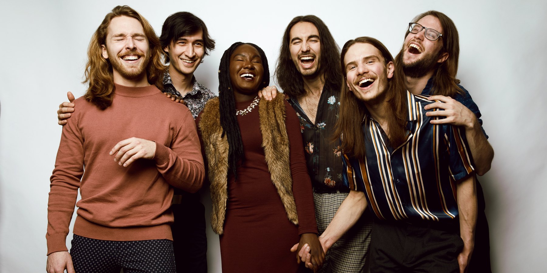 Carter and the Capitals — band portrait, six laughing together on white, Edmonton