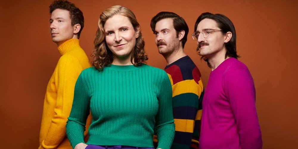 Major Love — band portrait in coloured sweaters on rust, Edmonton