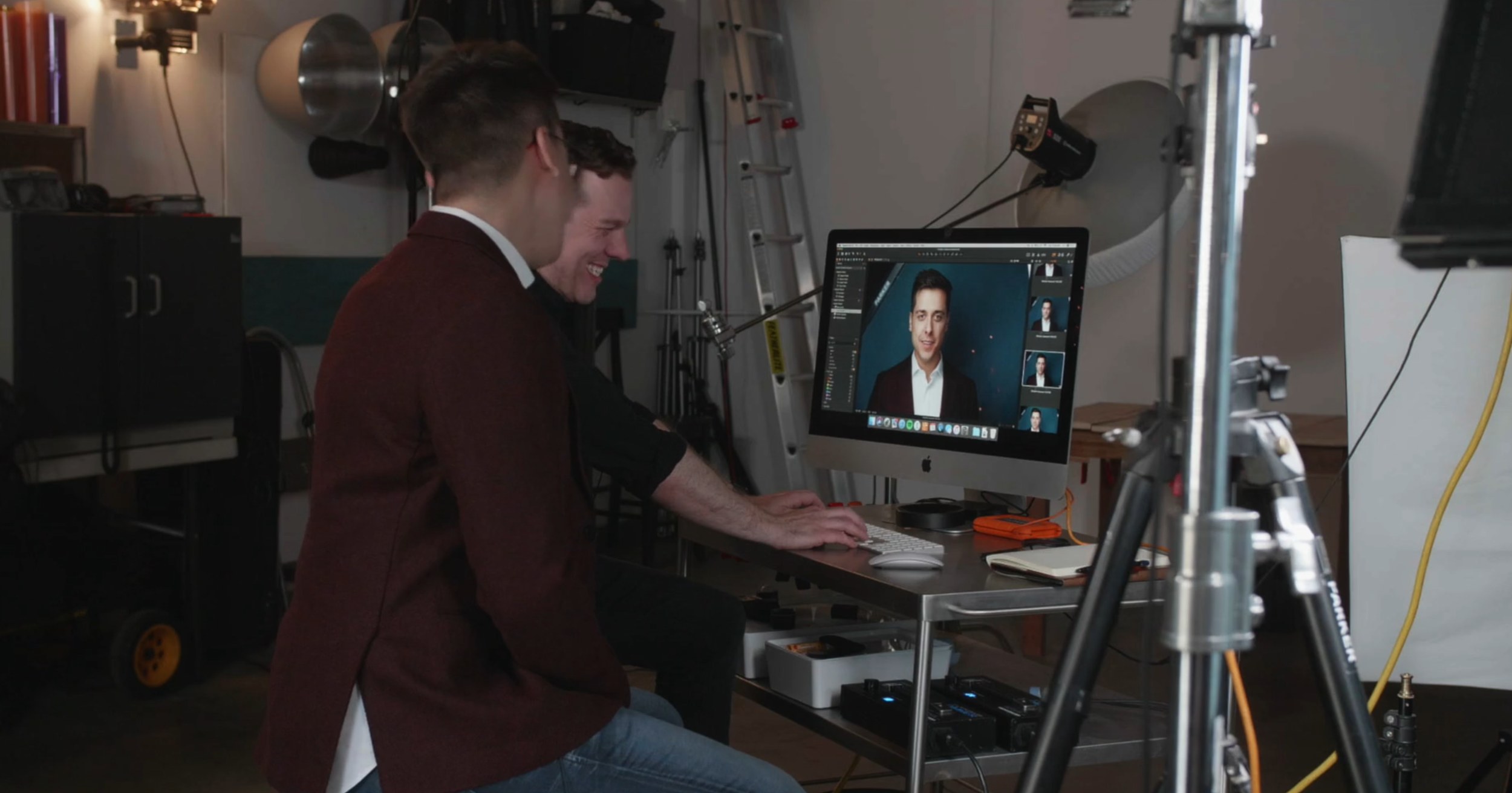 Choosing on the spot: a client at the screen beside the camera, picking his photo with Ryan