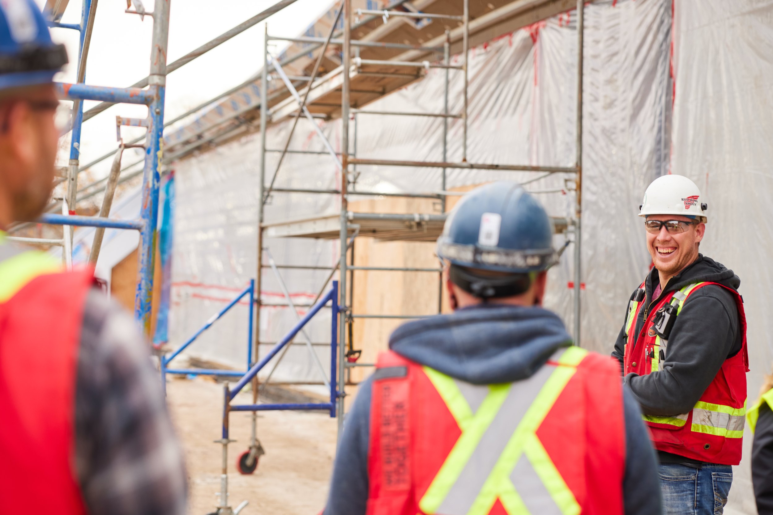 A conversation beside the scaffolding