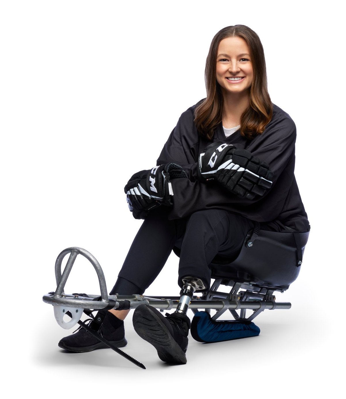 The same woman seated, the blade out in front of her