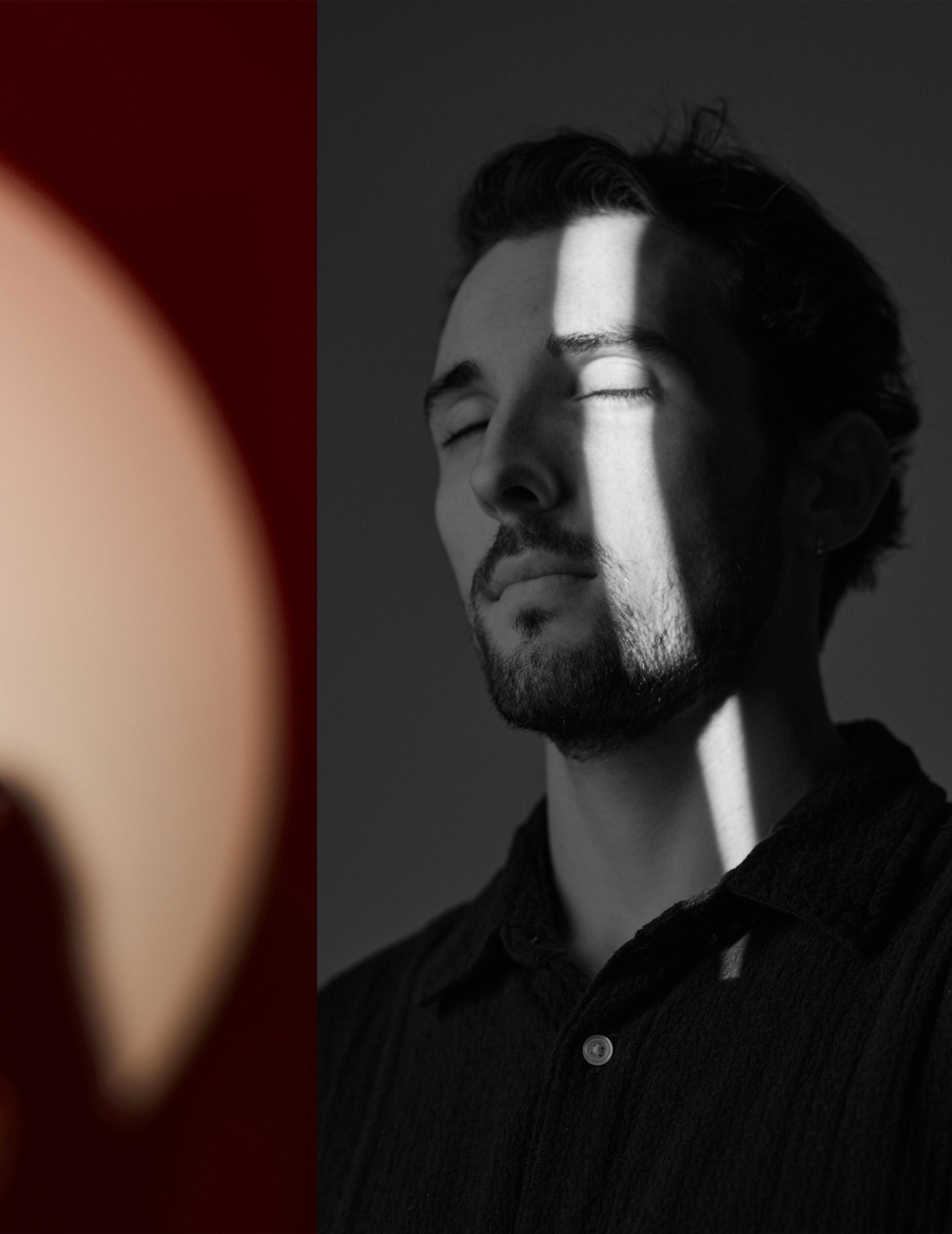 The same session, a slit of light across the face, eyes closed, red at the edge