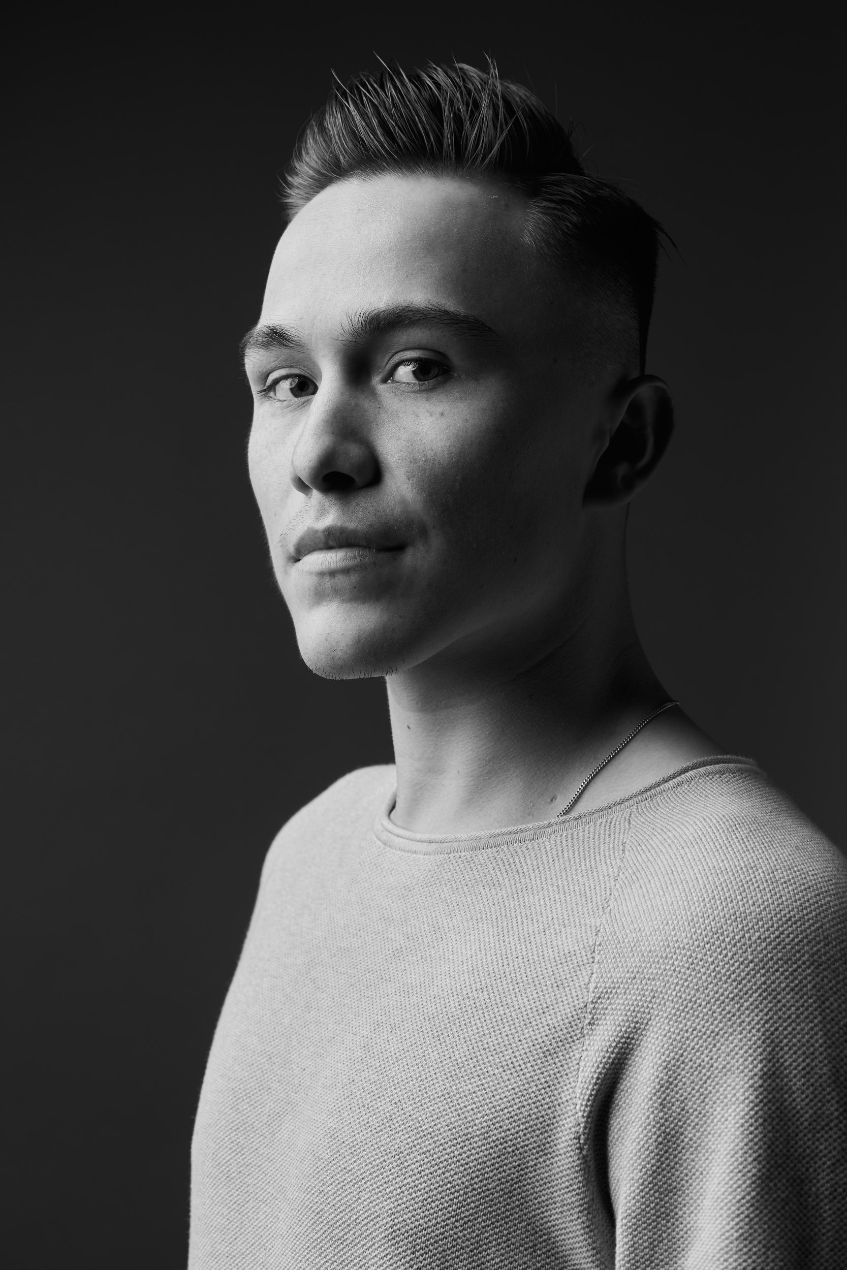 The same session in black and white, a grey sweater, turned