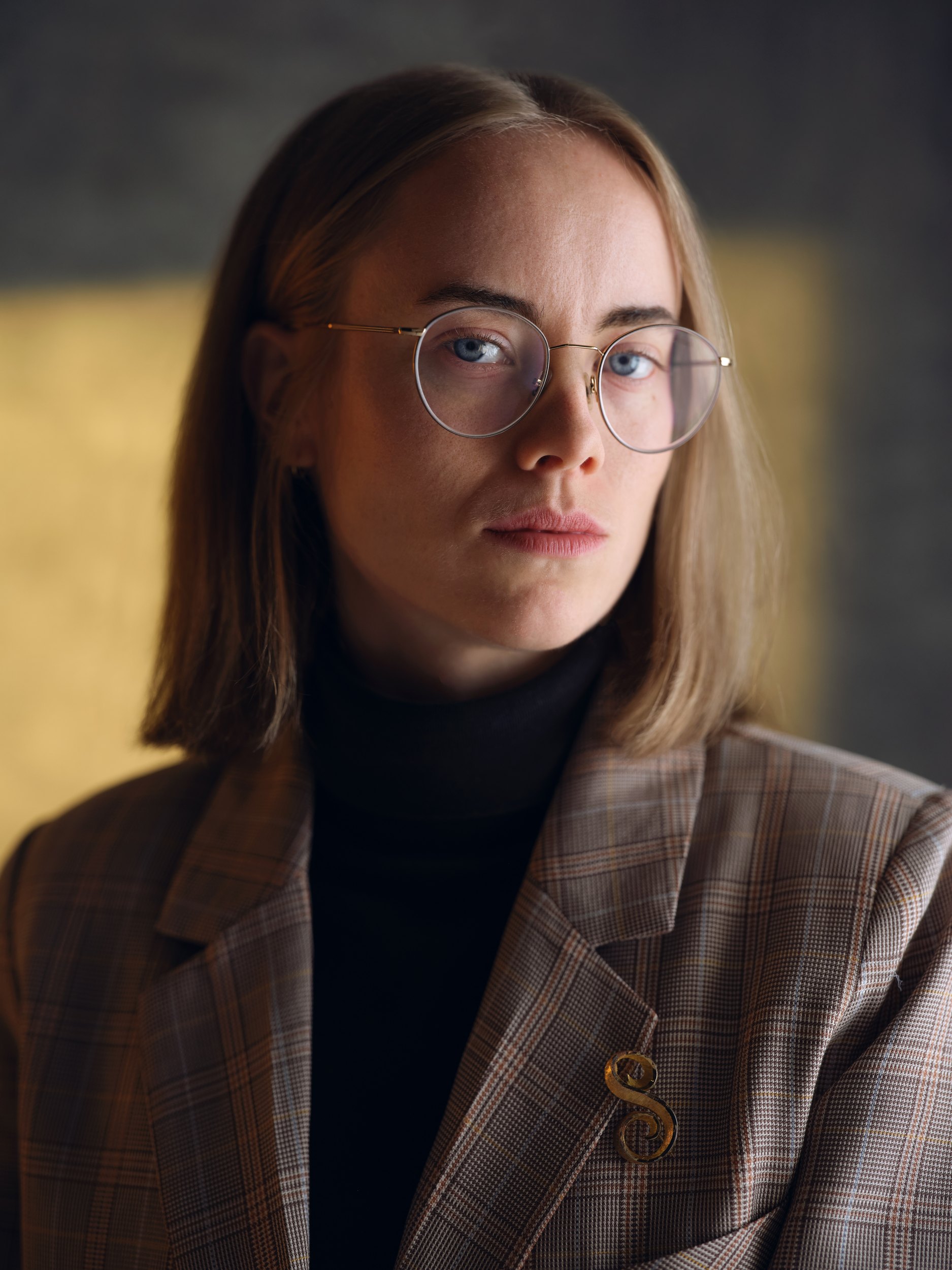 The same session in colour, a patch of window light on the wall behind