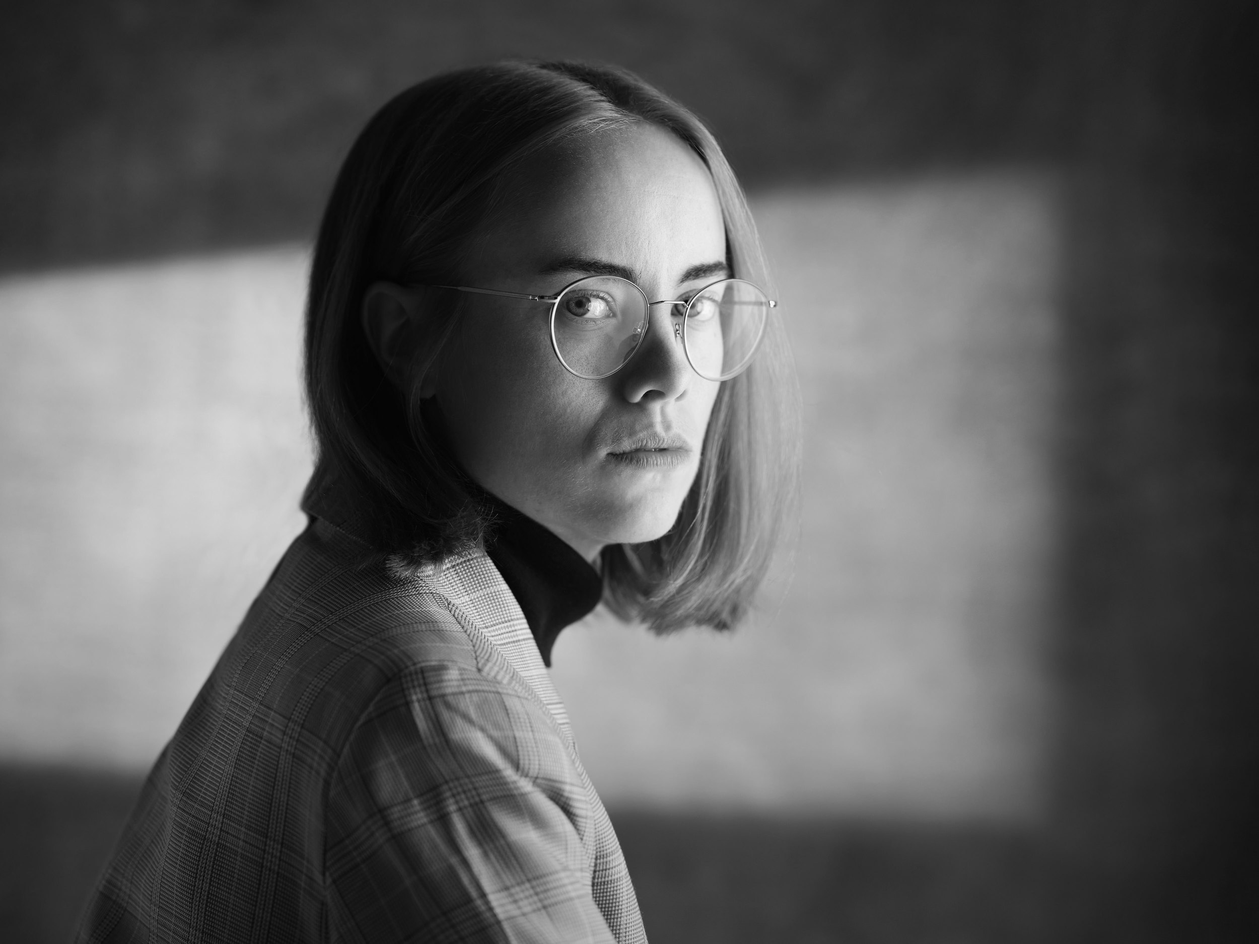 The same session, black and white, turned toward the window