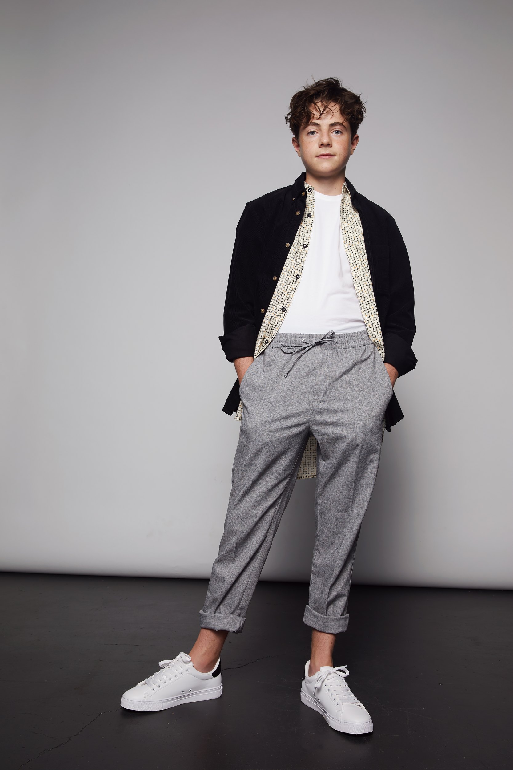 A black jacket over white, head to toe on white