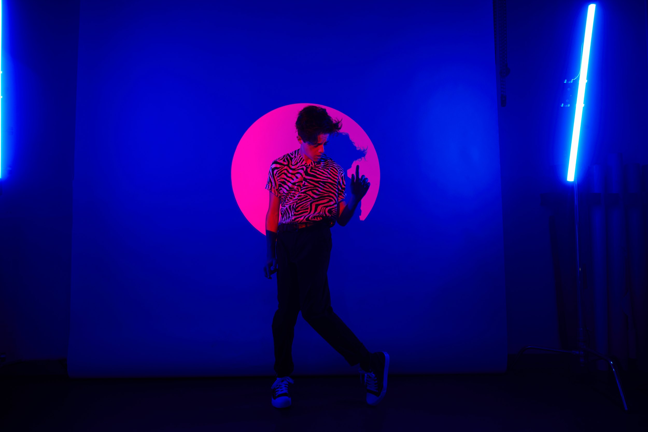 Mid-step in the blue room, a tube of blue light at the edge