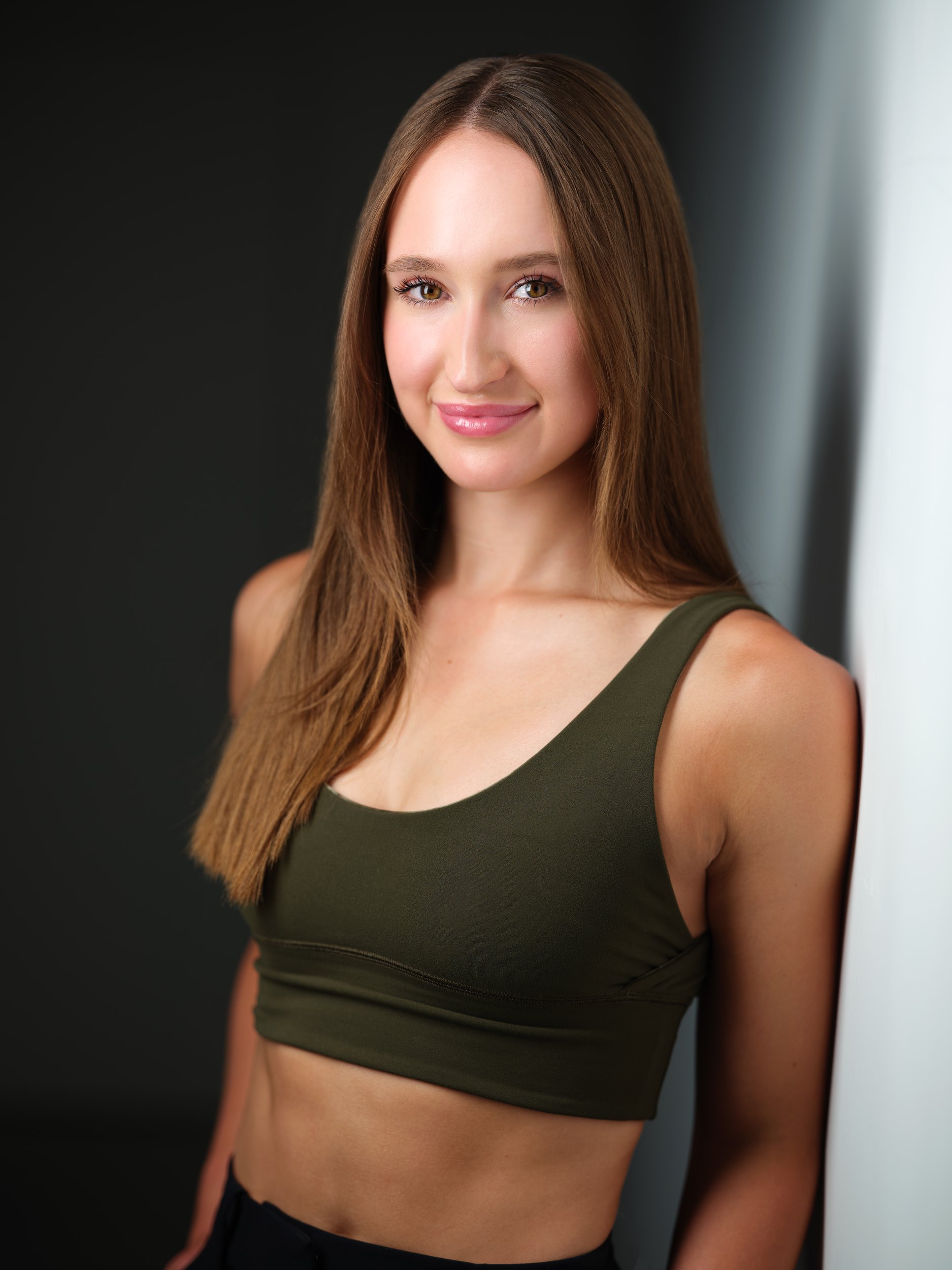 The same session, an olive top against the wall of light