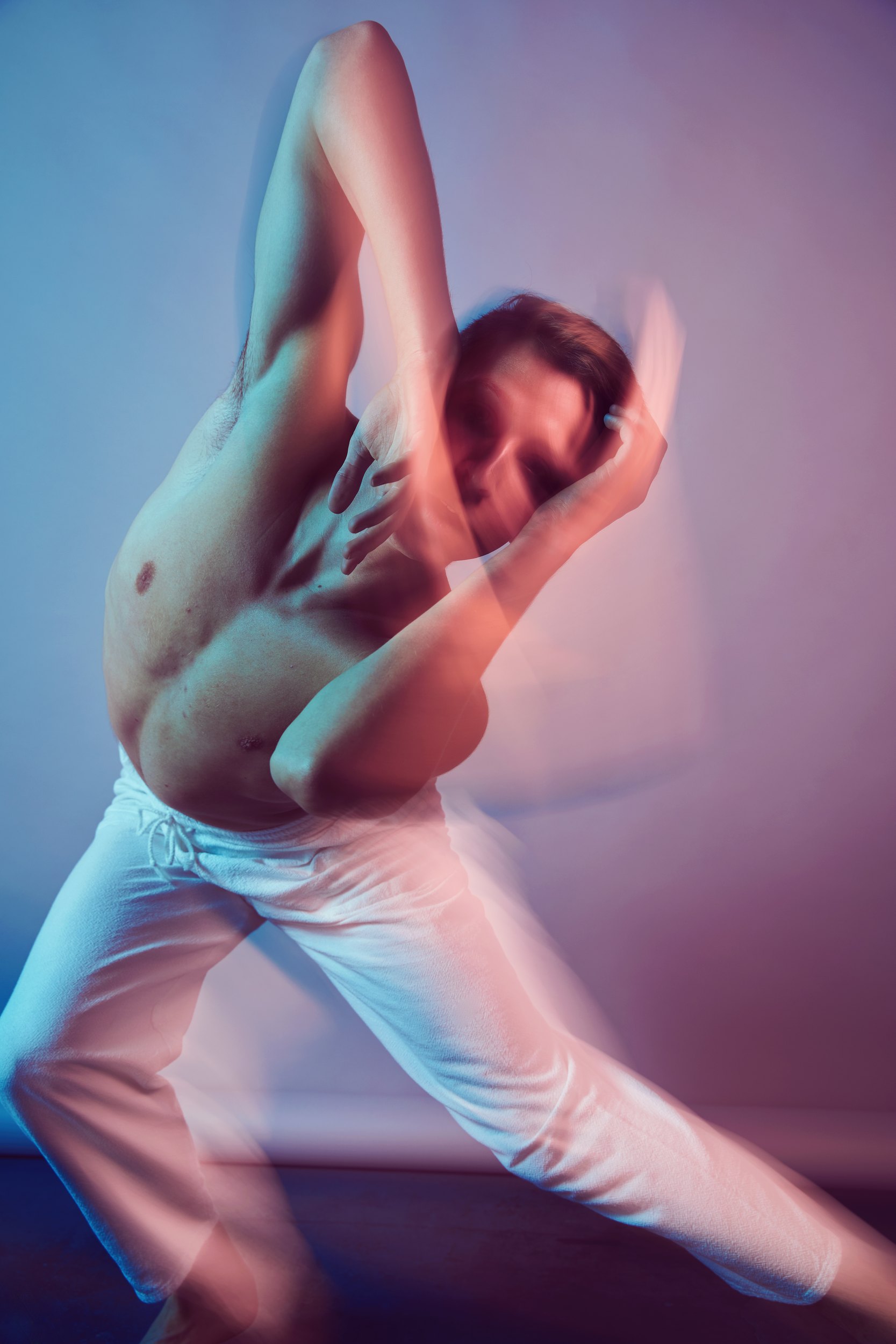 The same gels, a lunge with both arms crossed over his face, blurred with the move