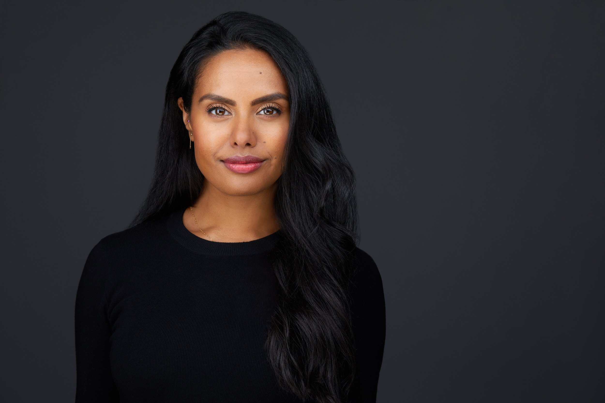 Dance headshot: a black top against charcoal