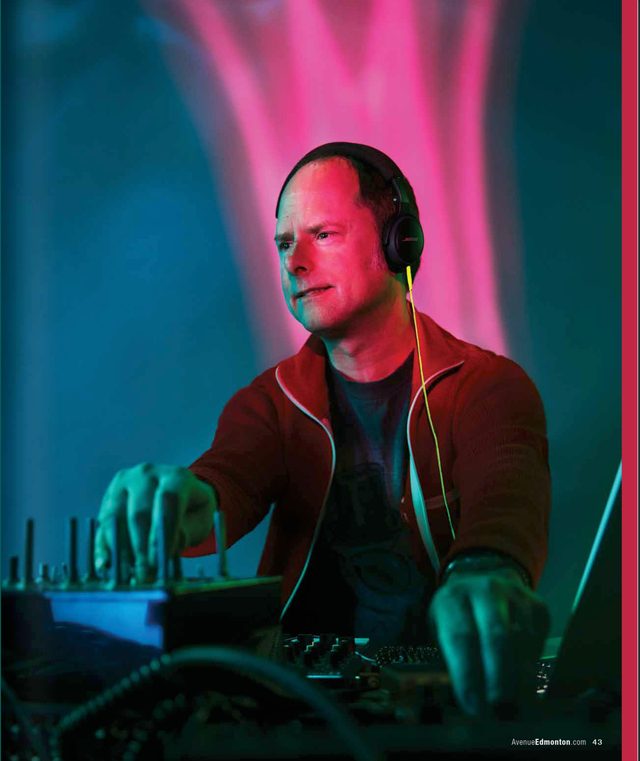 The facing page: a musician in headphones and a red jacket at his gear, pink light falling behind him