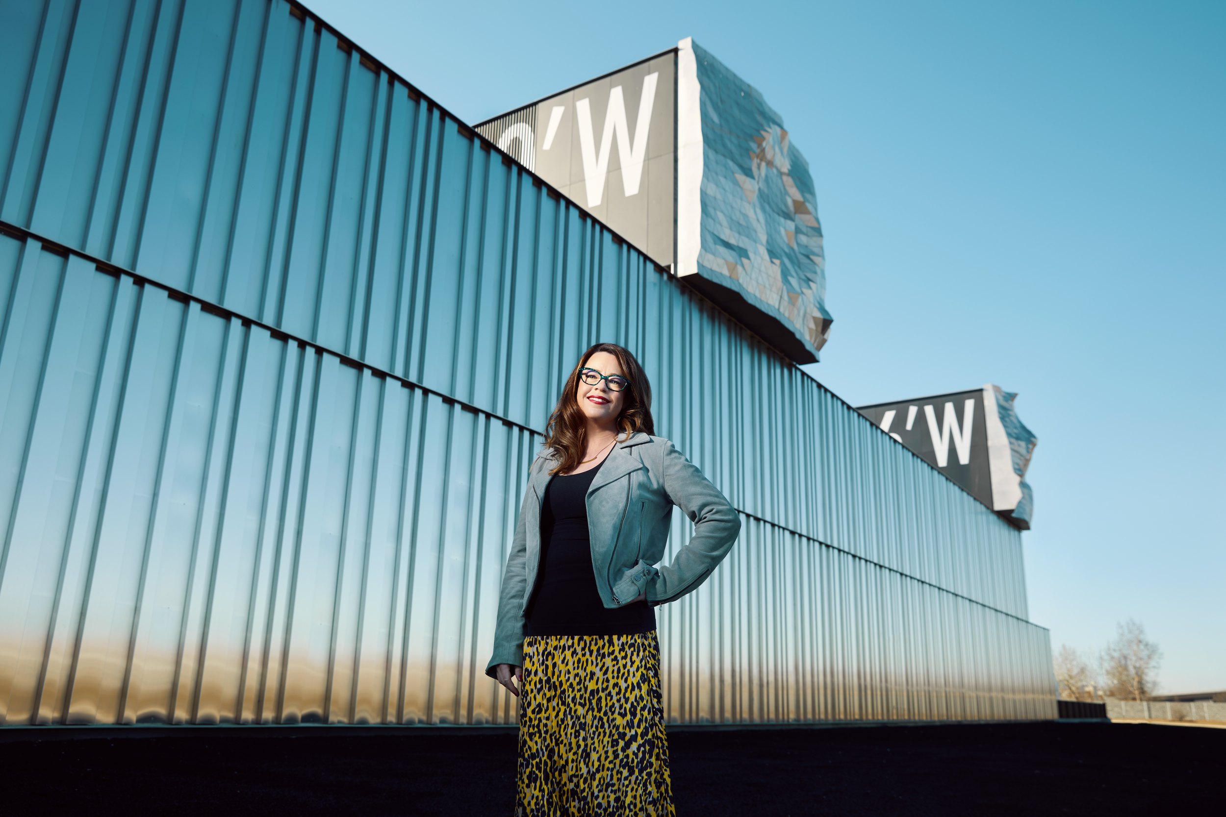 The same, from further along the wall, the line of it running out behind her