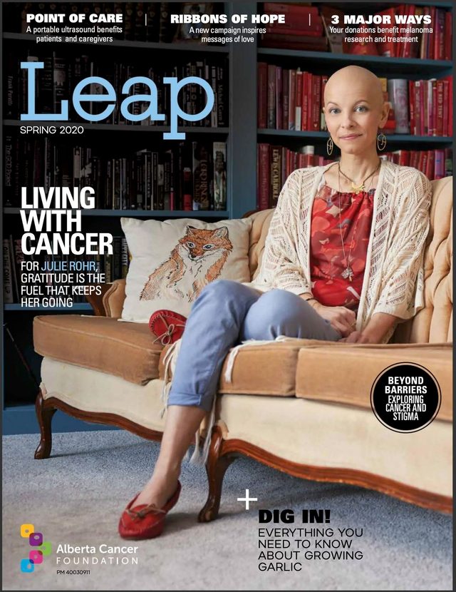 Leap magazine, Spring 2020: the cover, Julie Rohr seated on a sofa in a red top and cream cardigan