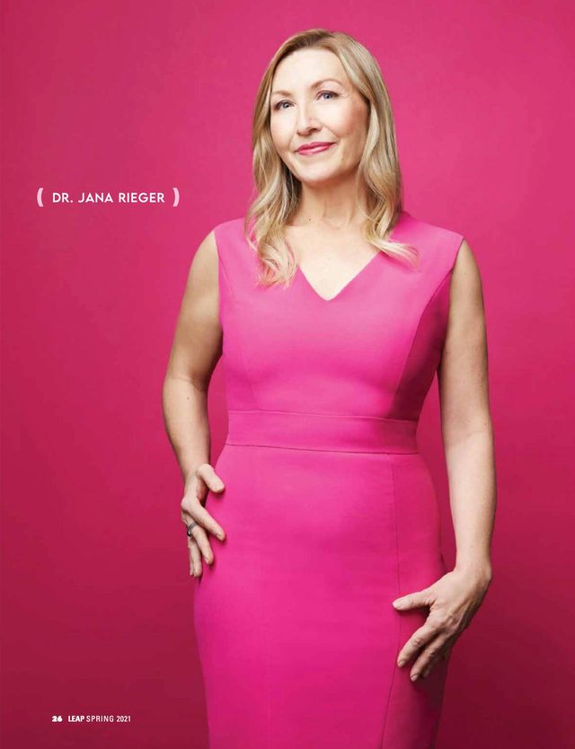 The opening page: Dr. Jana Rieger in a pink dress against pink, full length