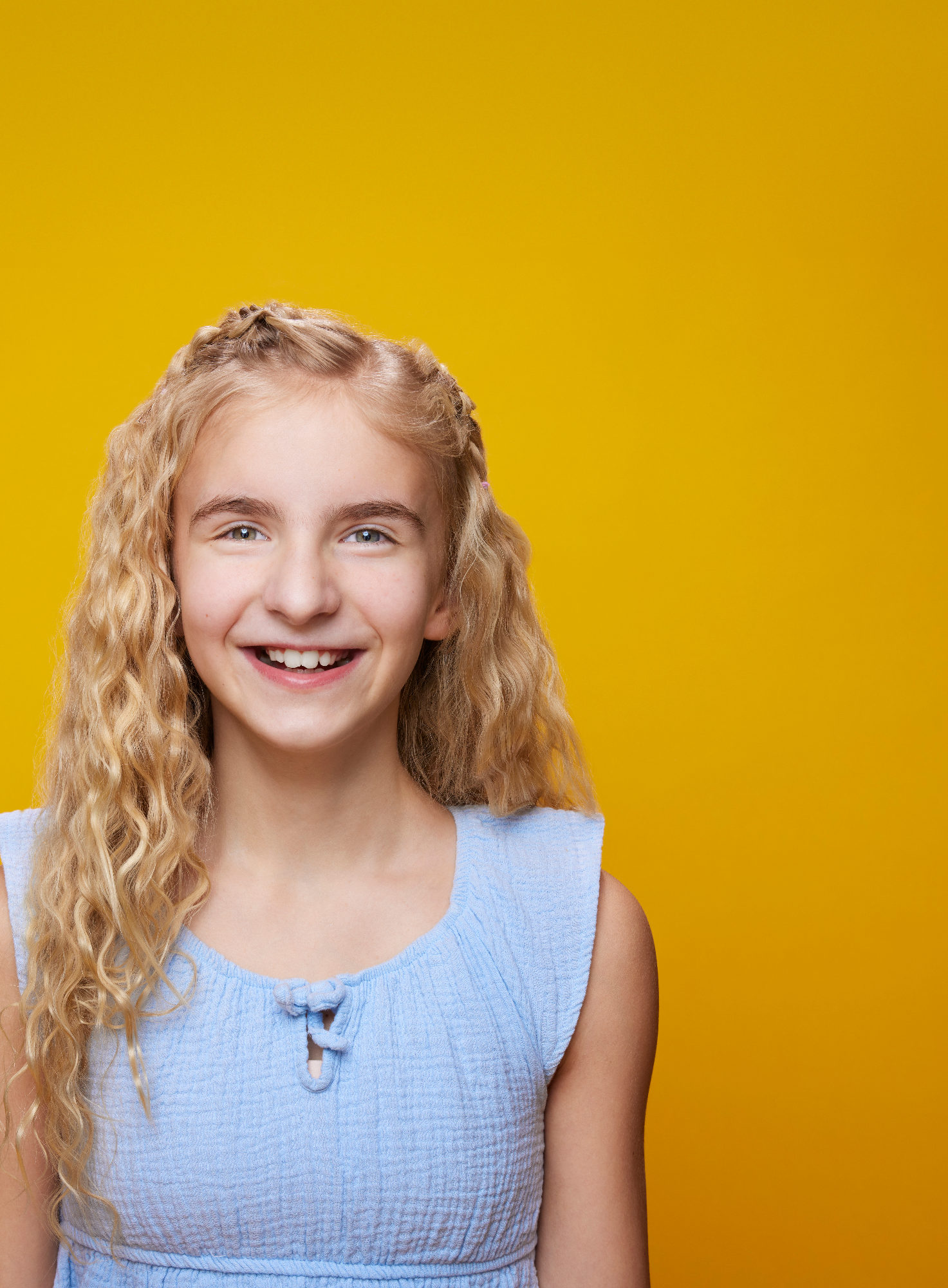 The photograph for the Reader’s Digest cover before the type: an eleven-year-old in a blue top, smiling, against yellow