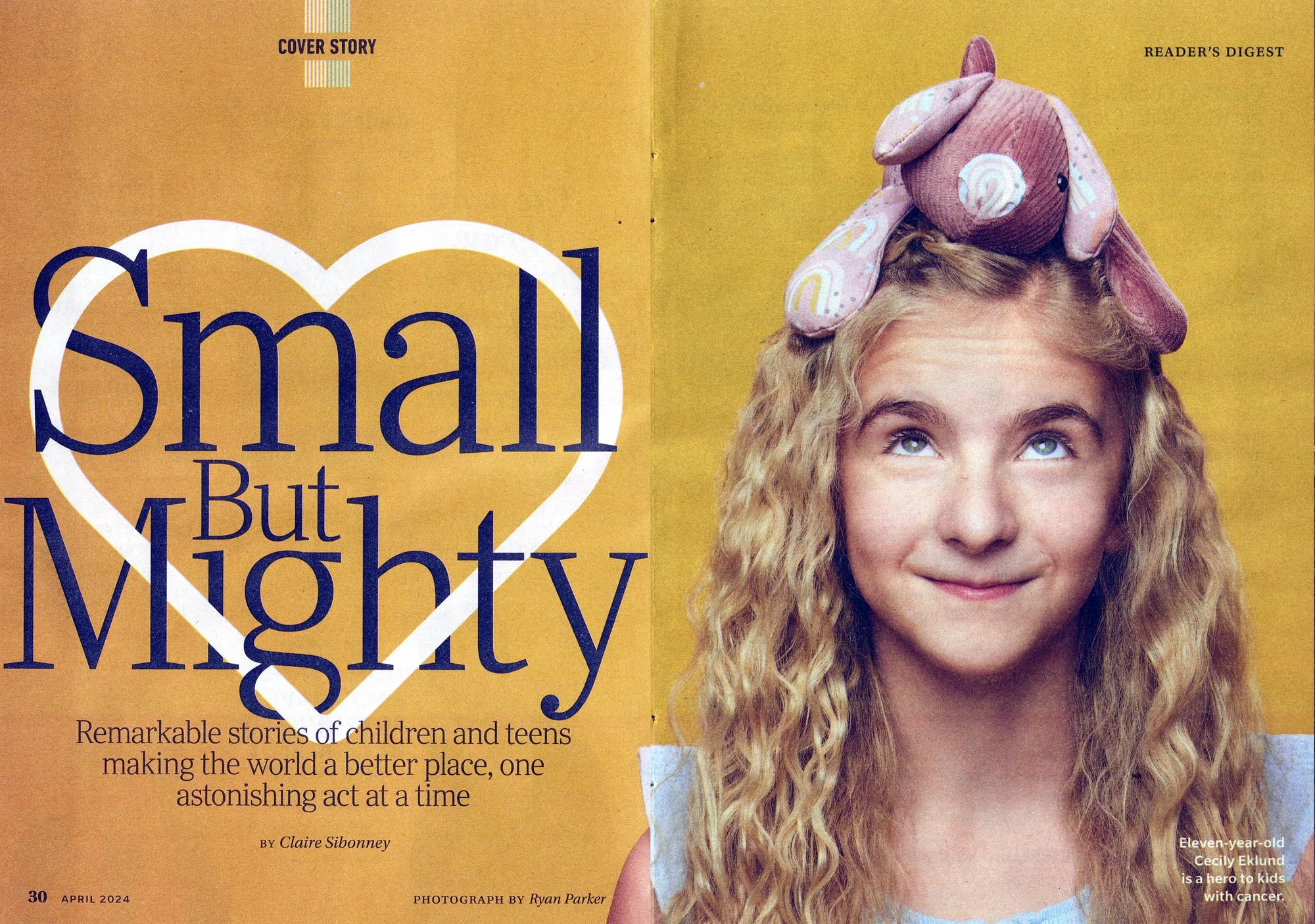 The cover story spread, Small But Mighty: the same girl with a stuffed animal on her head