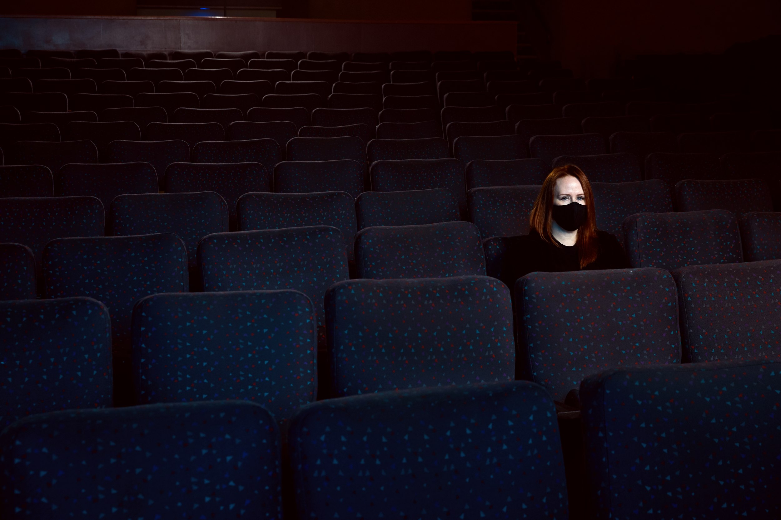 Edify’s art director, Kim Larson, masked in the empty rows of the Garneau during the shoot