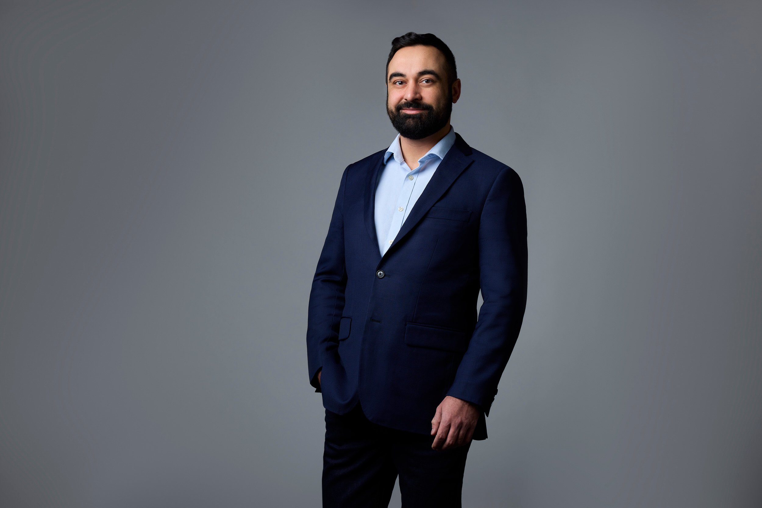 Leadership portrait: a navy suit, standing