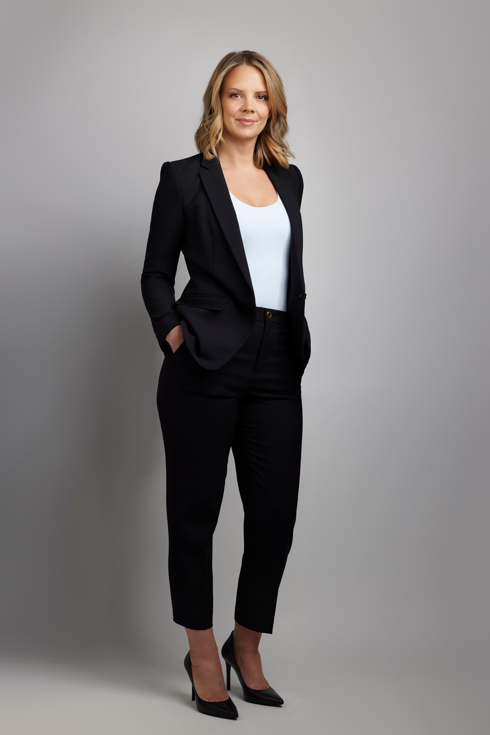 Leadership portrait: a black suit, full length