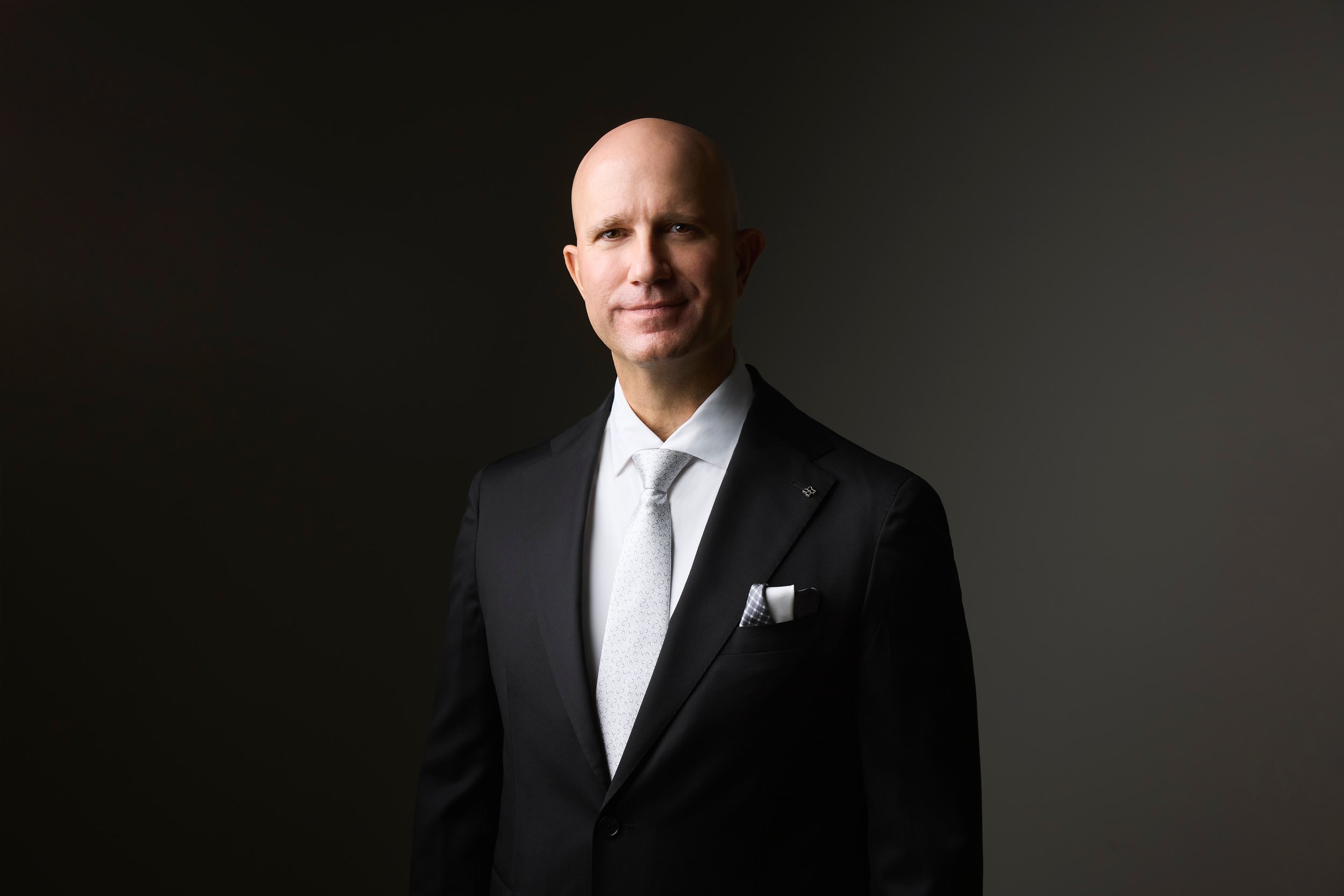 The same session: a black suit in low light
