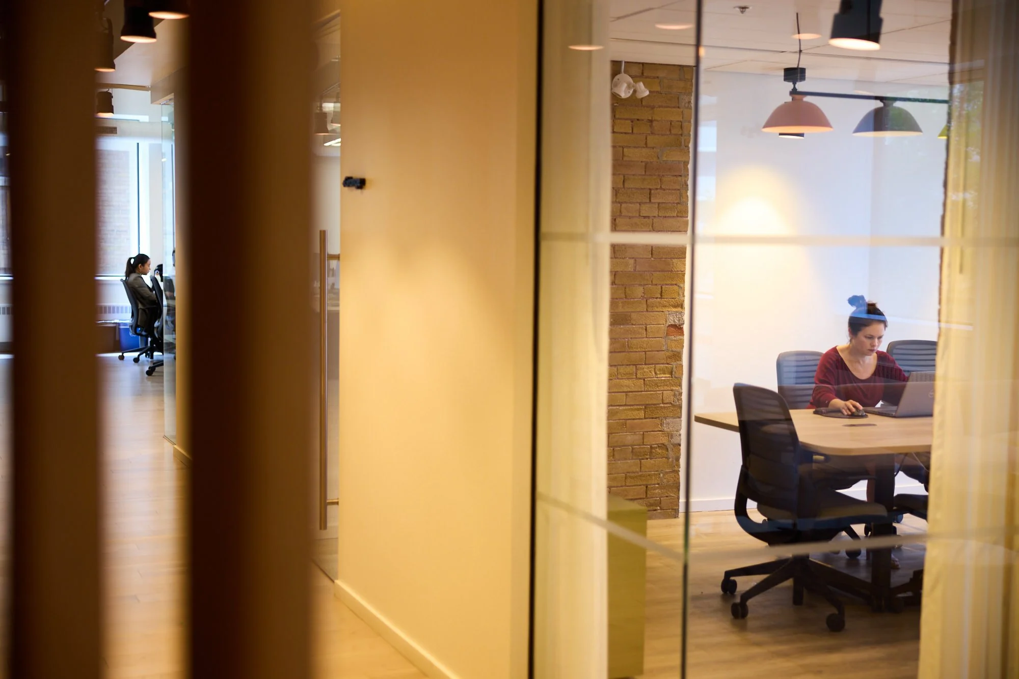 A meeting room seen through glass, Toronto