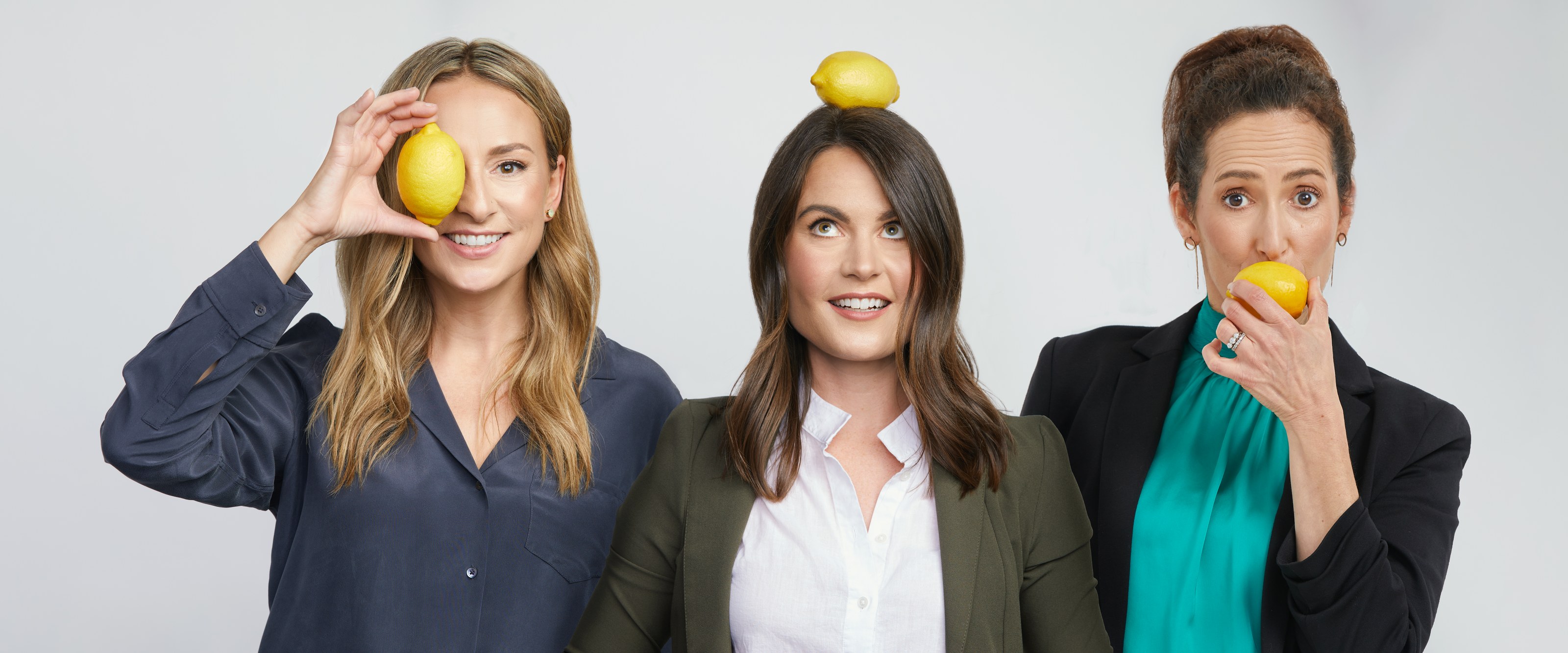Group photo of three founders on white, each holding a lemon