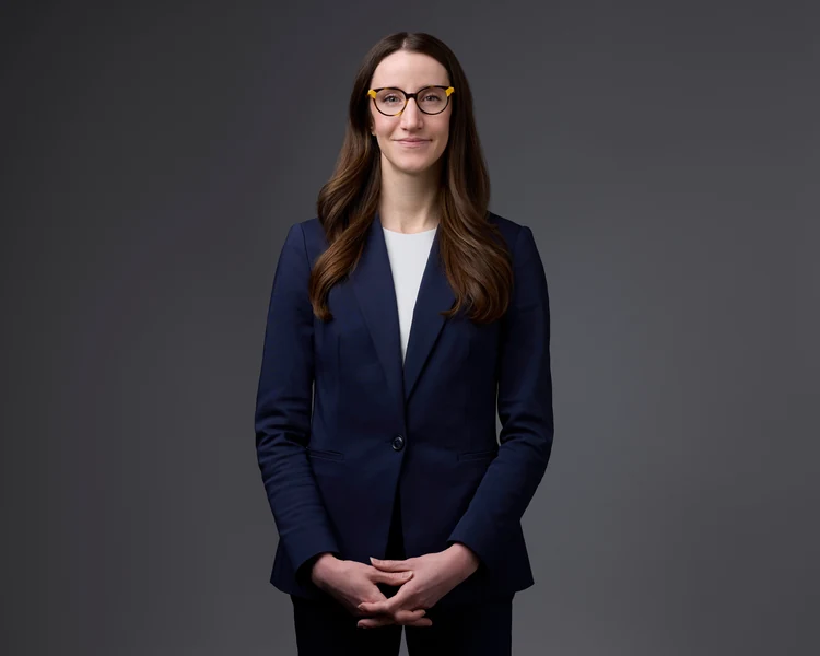 The same session, navy suit on grey