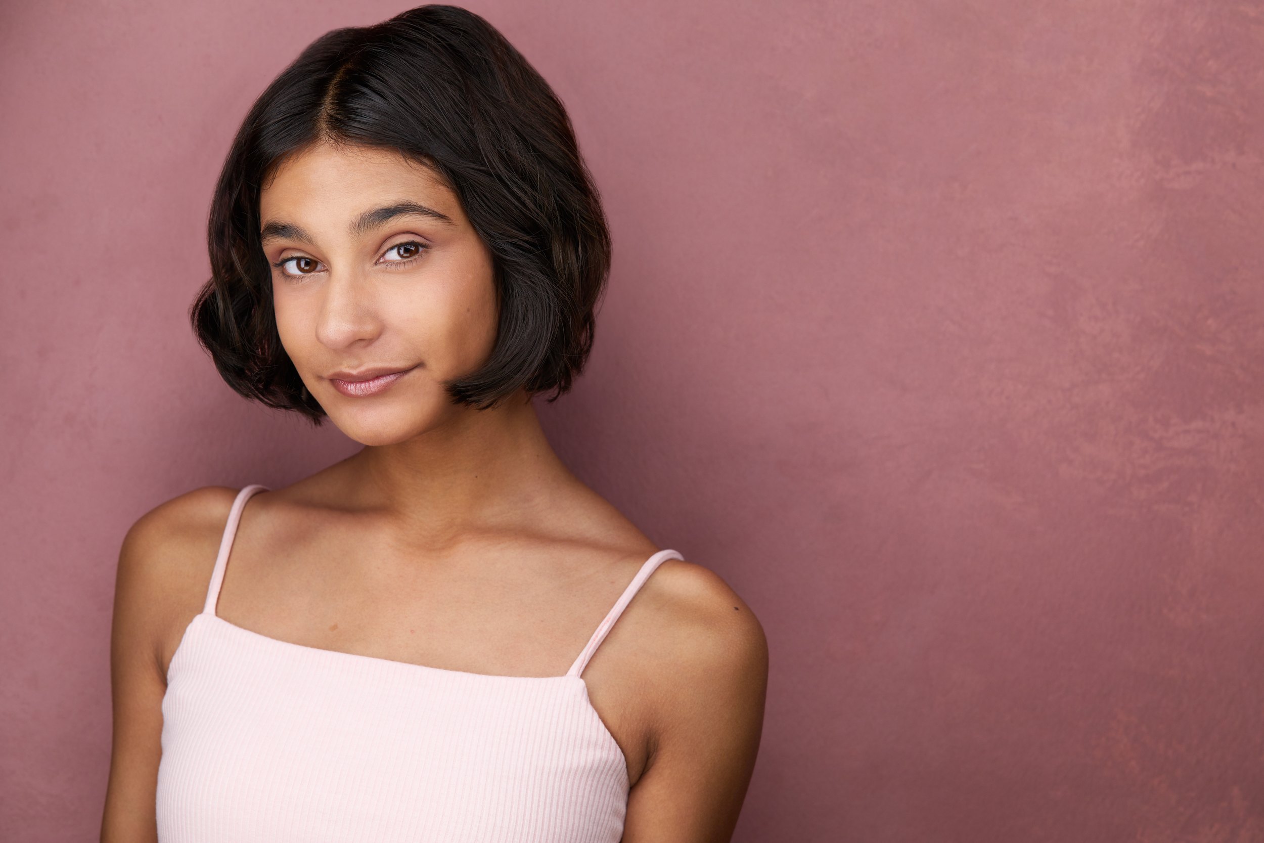 The same session, a pale pink cami against dusty pink
