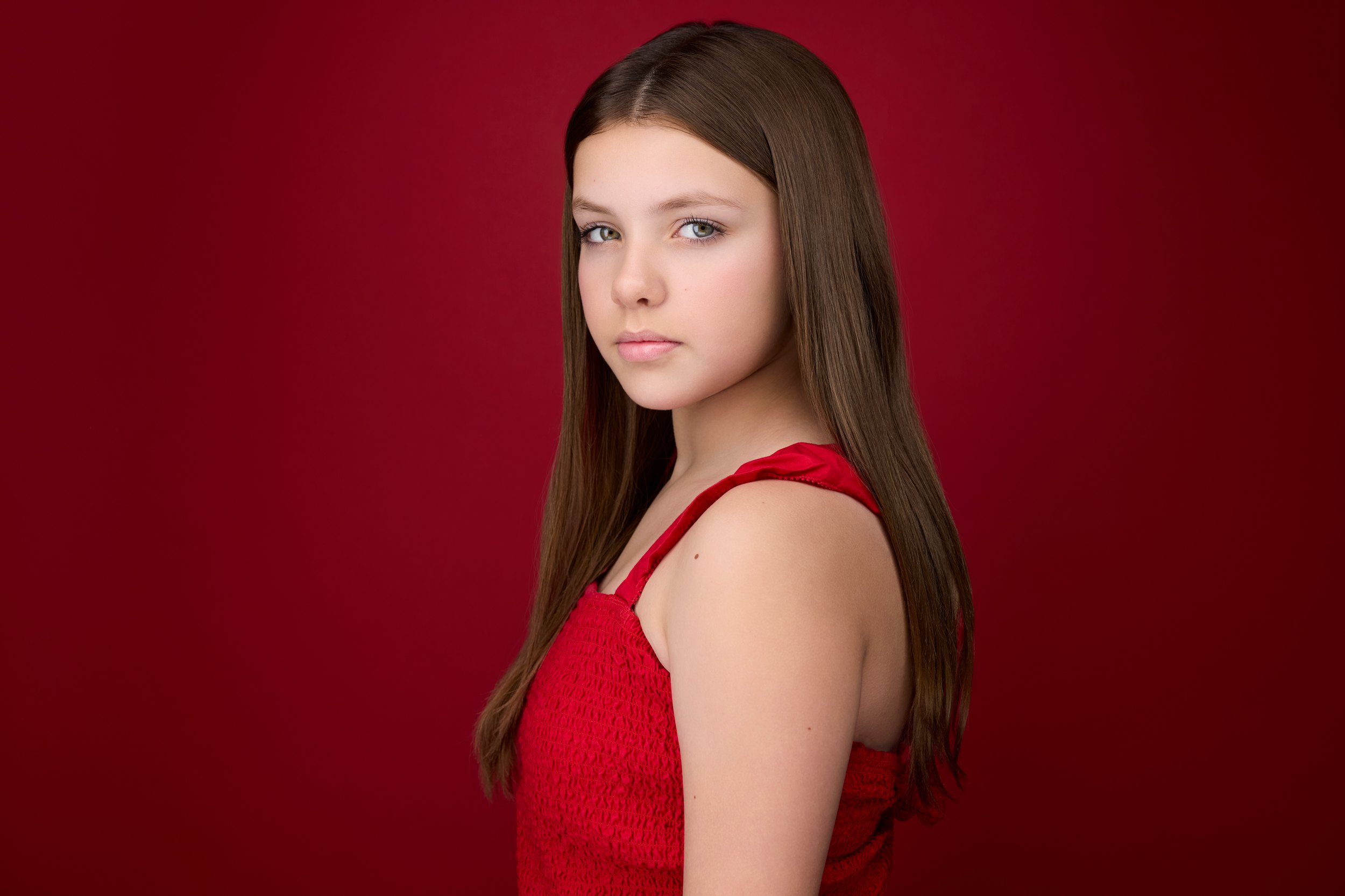 Kids and teens headshot: a red top against red