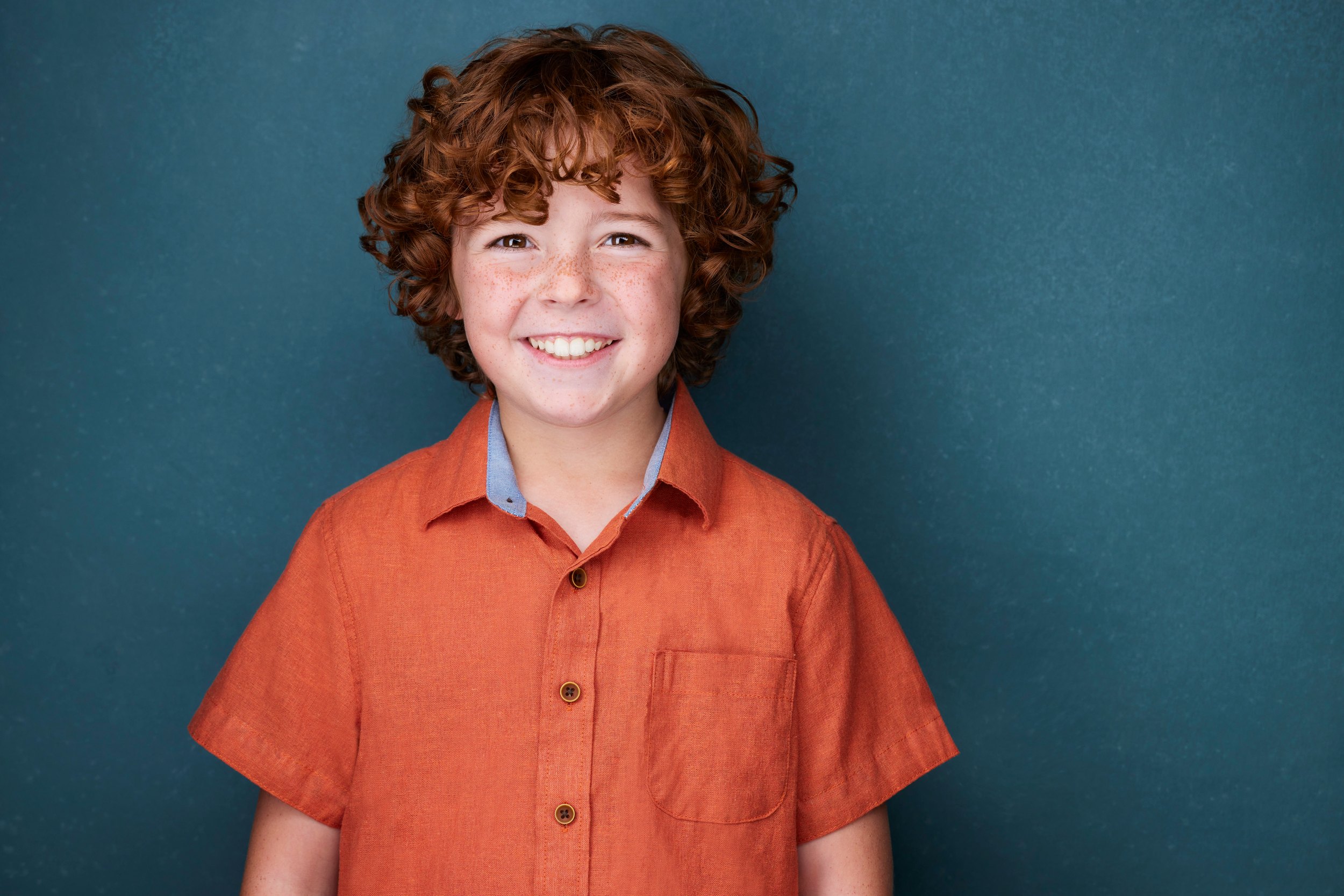 The same session, an orange shirt against teal
