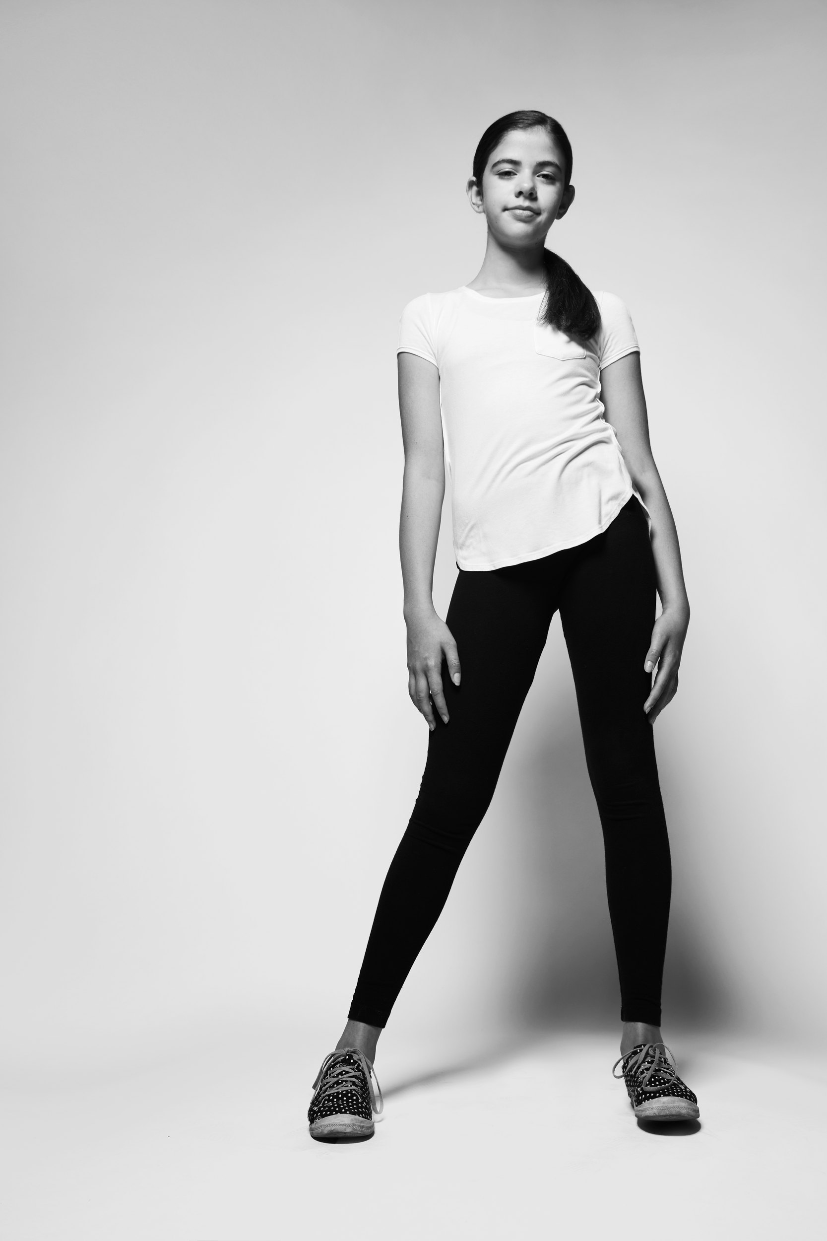 The same session, a white tee and black leggings, head to toe on white