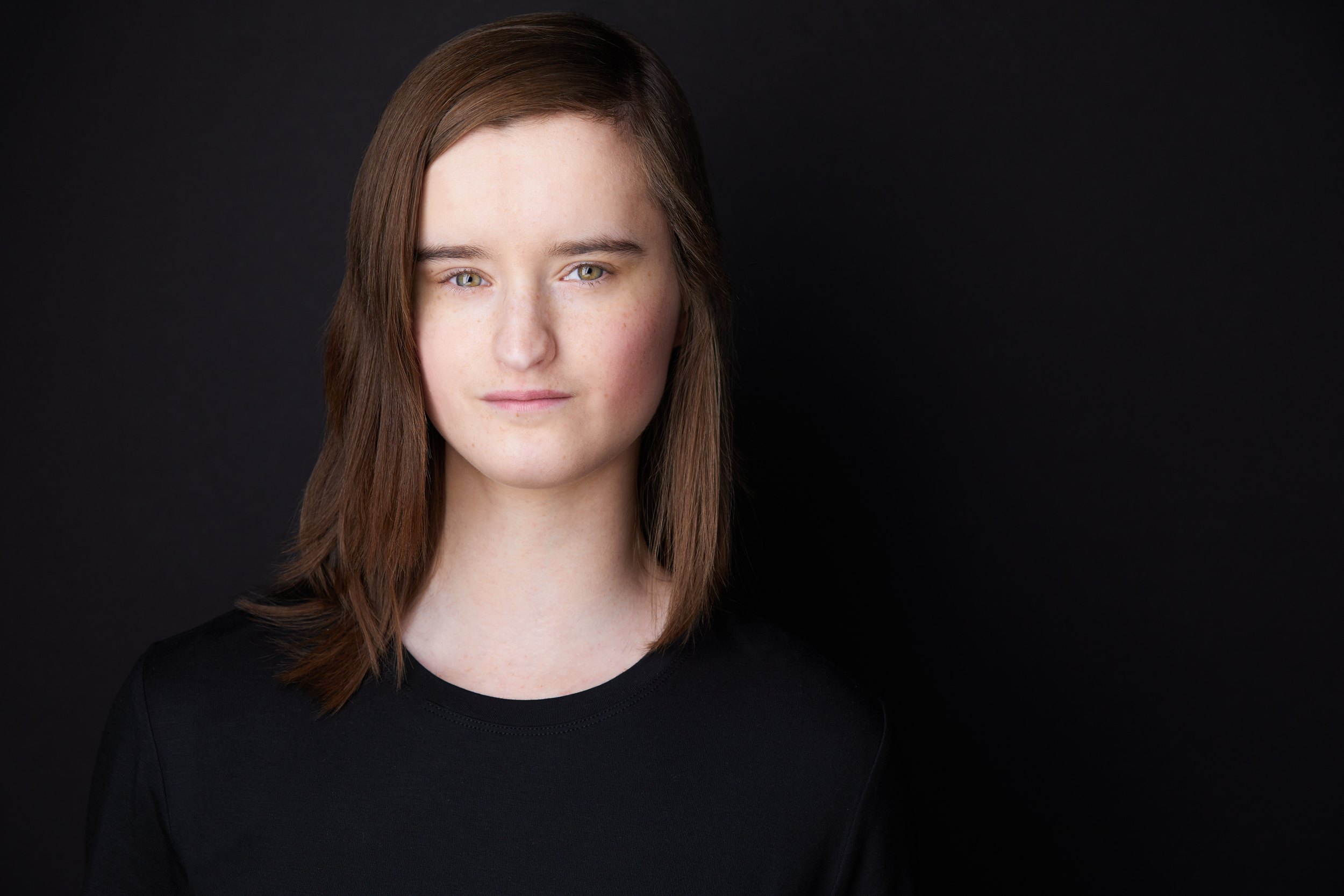 Kids and teens headshot: a black top against charcoal