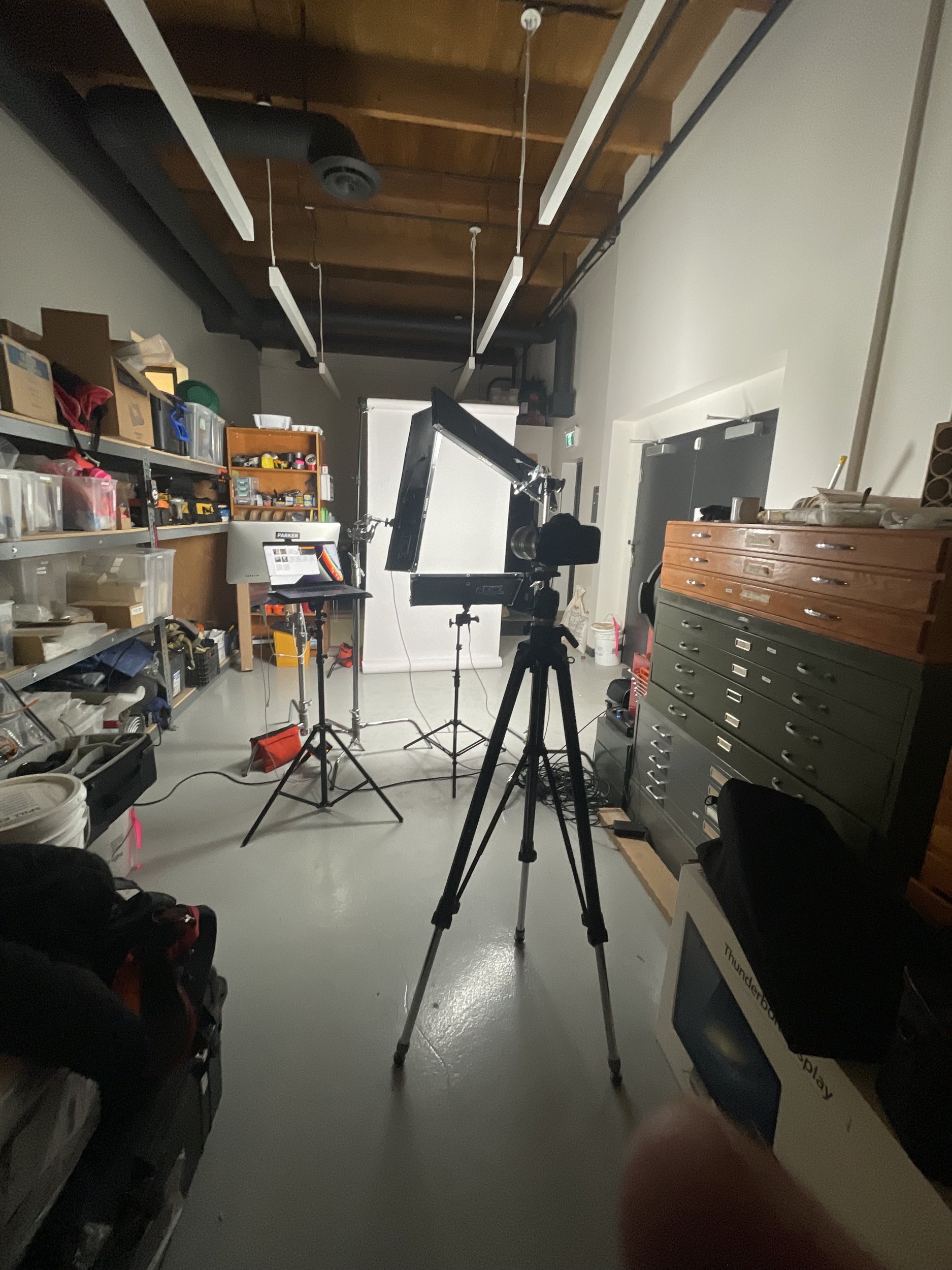 Ryan Parker’s on-location headshot setup, lights, backdrop and tethered screen, in a warehouse