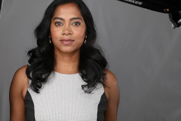 The same session, a frame as shot: a patterned top on grey