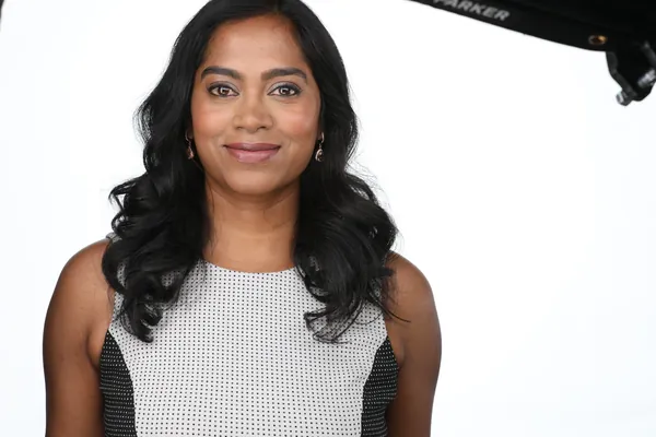 The same session, a frame as shot: a patterned top on white