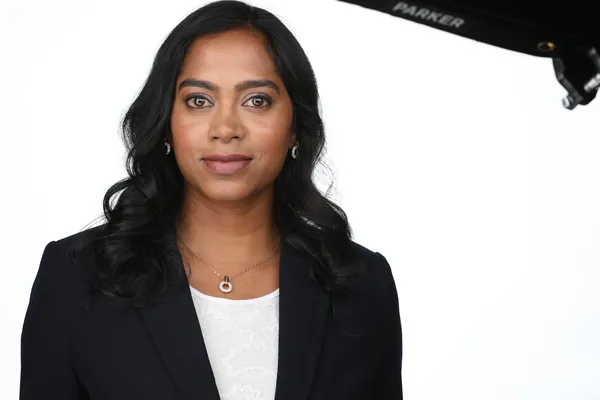The same session, a frame as shot: a navy blazer on white
