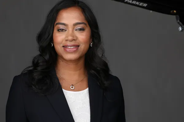 The same session, a frame as shot: a navy blazer on grey