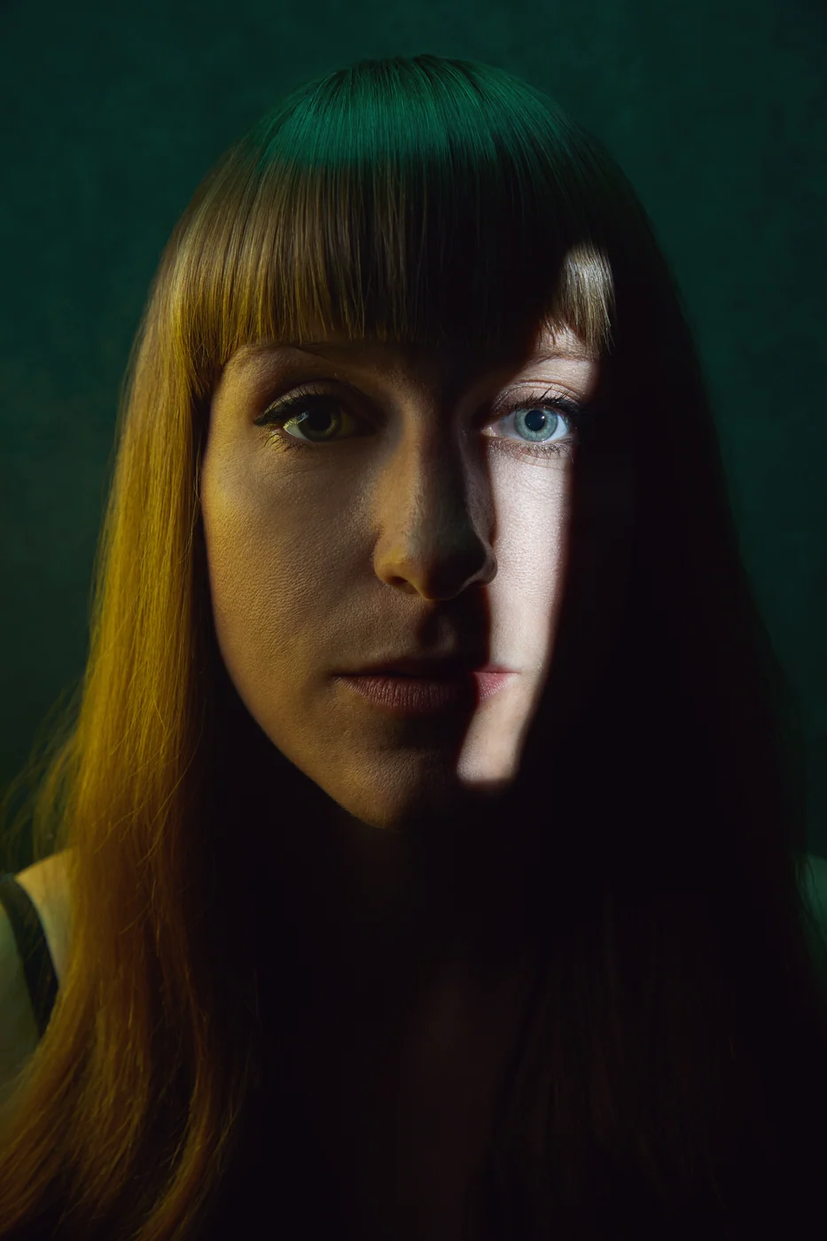 Portrait from Ryan Parker’s Slice of Light series — a single slice of light across the face, Edmonton