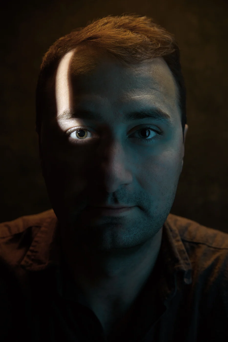 Portrait from Ryan Parker’s Slice of Light series — a single slice of light across the face, Edmonton