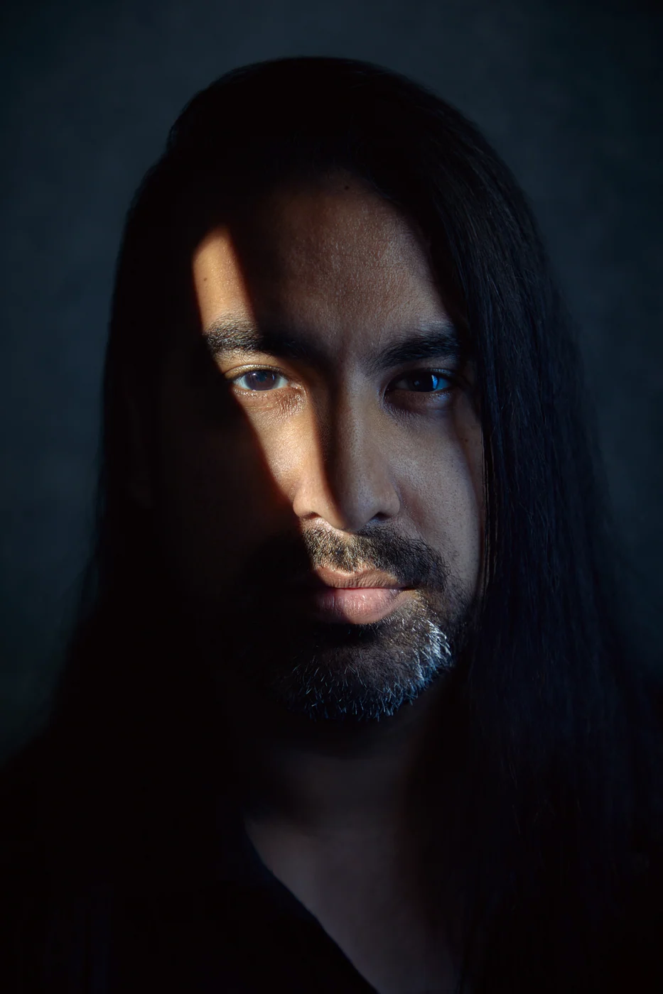 Portrait from Ryan Parker’s Slice of Light series — a single slice of light across the face, Edmonton