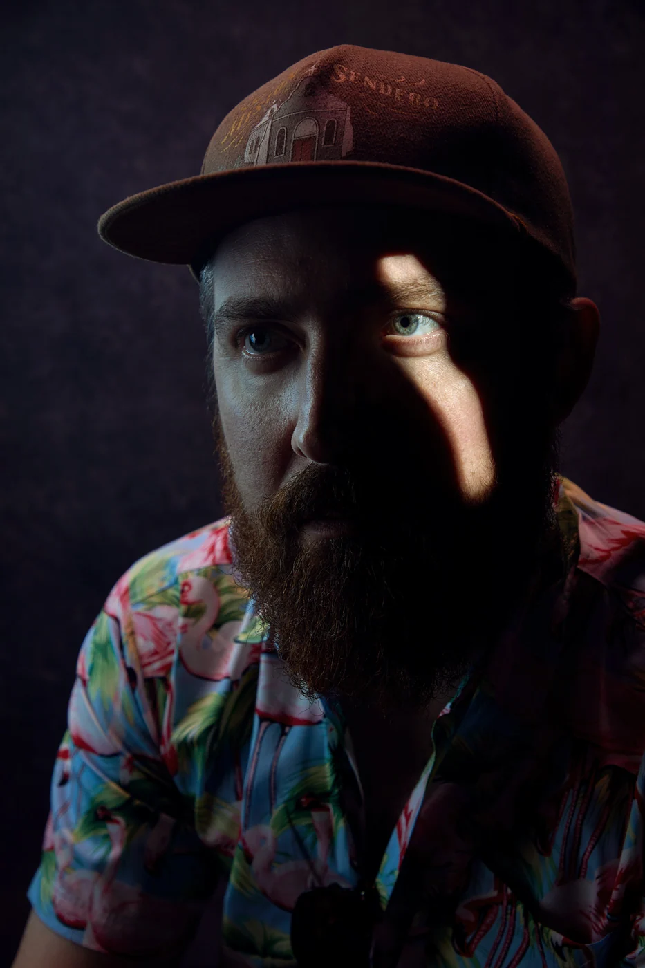 Portrait from Ryan Parker’s Slice of Light series — a single slice of light across the face, Edmonton