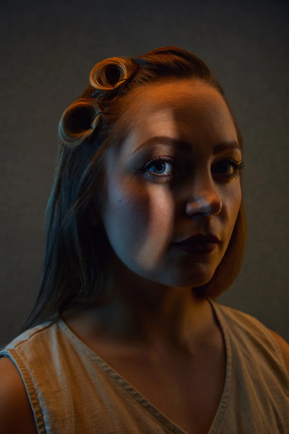 Portrait from Ryan Parker’s Slice of Light series — a single slice of light across the face, Edmonton