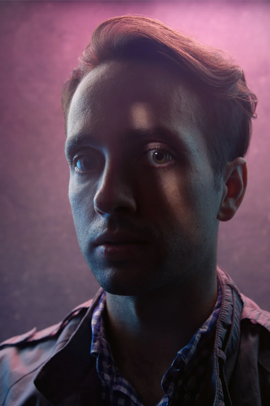 Portrait from Ryan Parker’s Slice of Light series — a single slice of light across the face, Edmonton