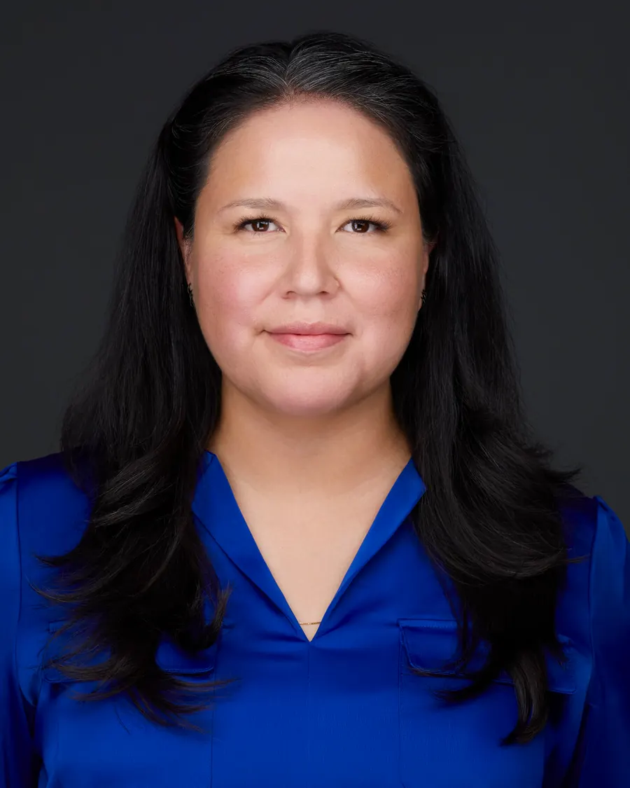 Chivers Carpenter staff headshot, Edmonton: a royal blue blouse, on charcoal