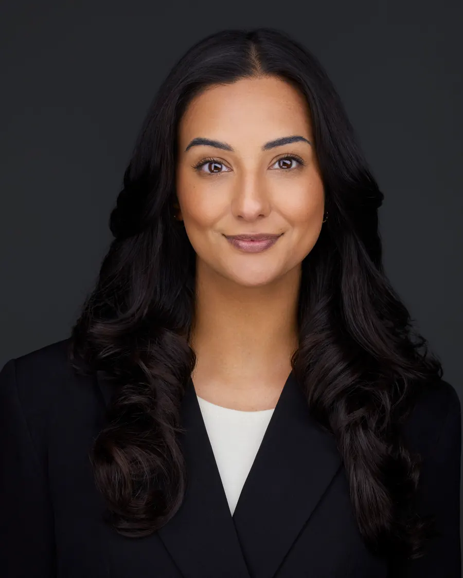 Chivers Carpenter staff headshot, Edmonton: a black blazer over cream, on charcoal
